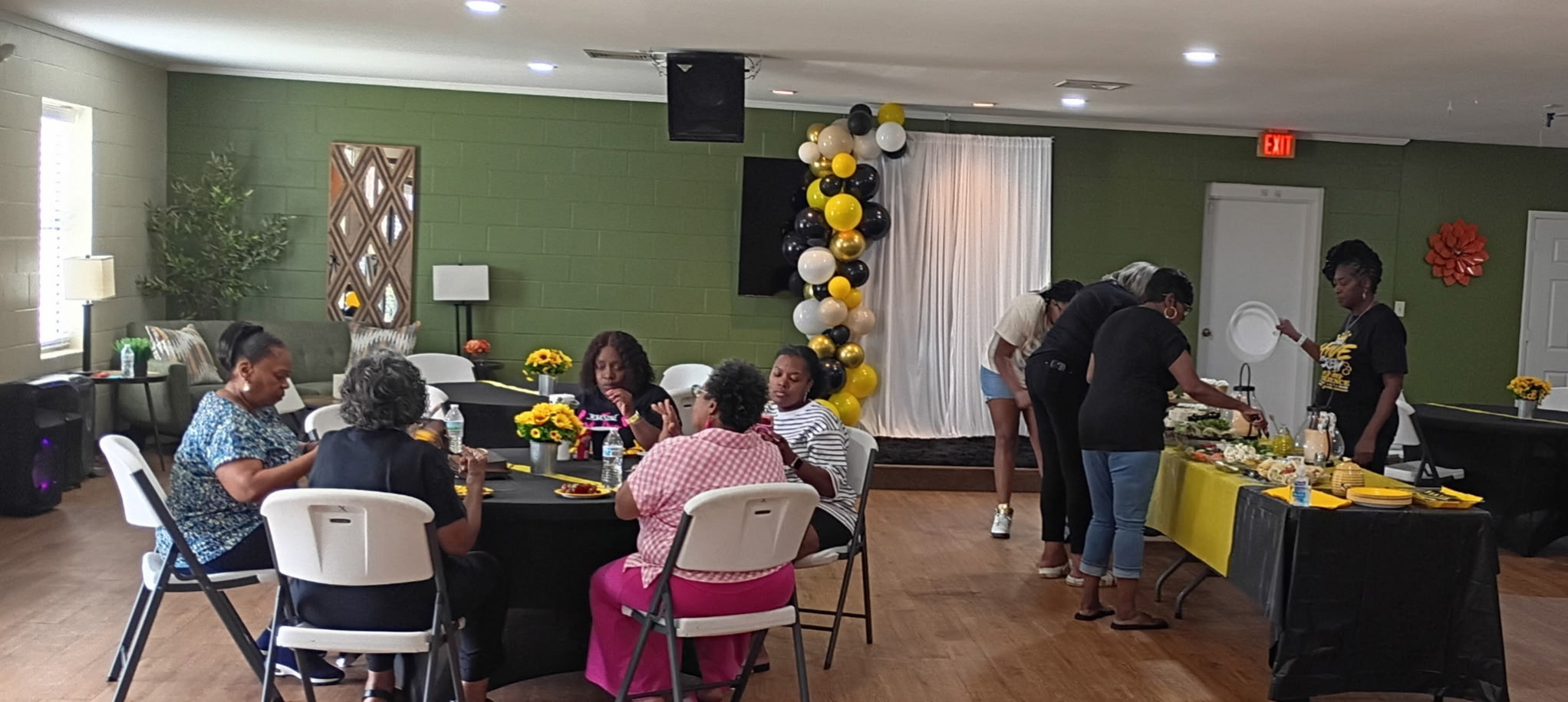 Guests socializing during a Bee's Tees Experience event