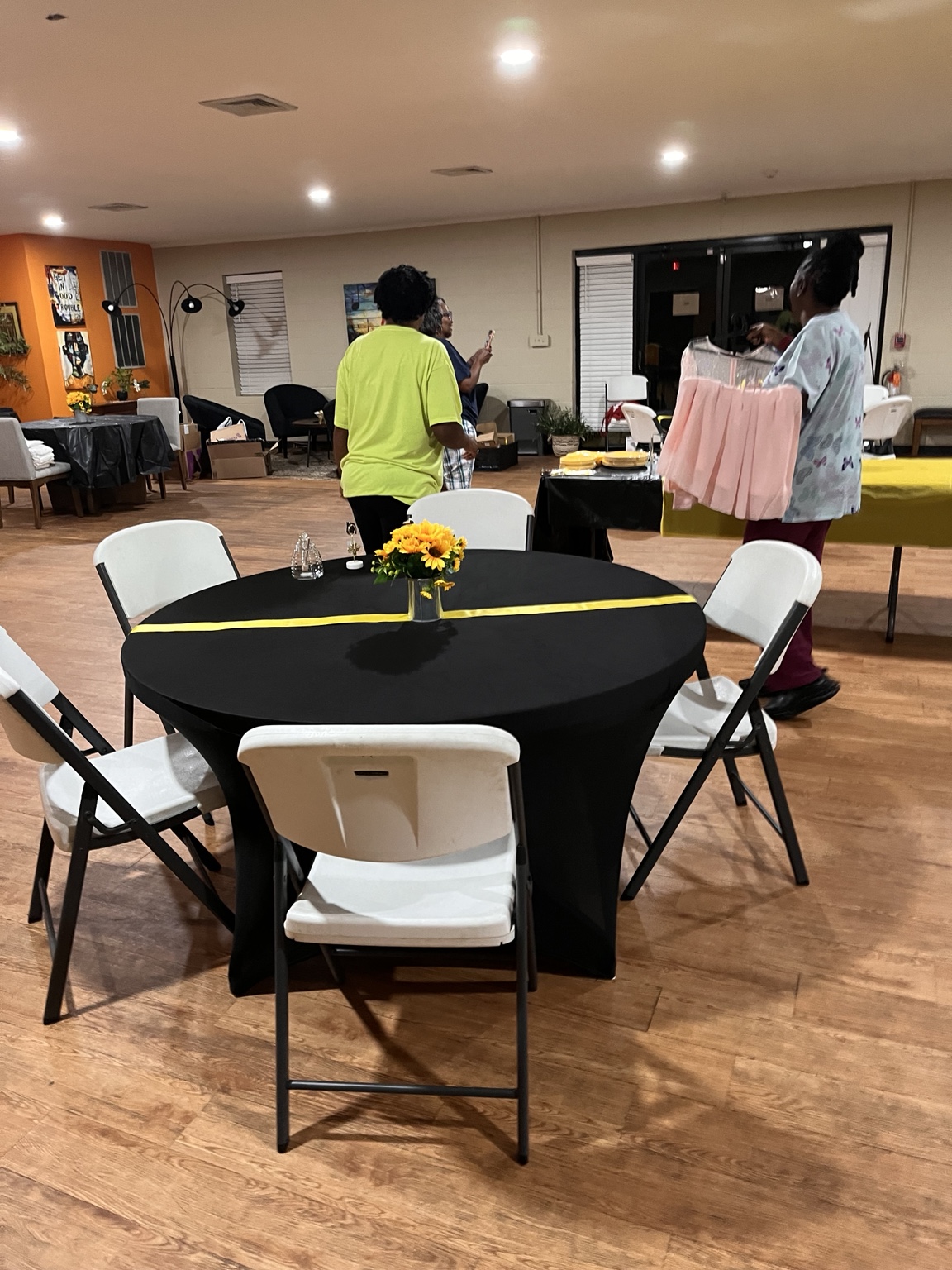 Tables and chairs prepared for guests at a Bee's Tees Experience event